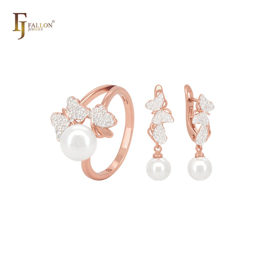 Conjunto de joyas de dos tonos en oro rosa con mariposa y corazón de circonitas blancas y perla, y anillos.