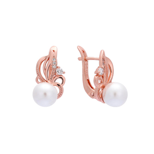 .Aretes de perlas en oro de 14 quilates, oro rosa, colores de baño en dos tonos.