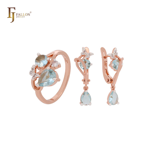 Conjunto de joyas de dos tonos con anillos en oro rosa y circonitas blancas en racimo de mariposas azules y blancas.