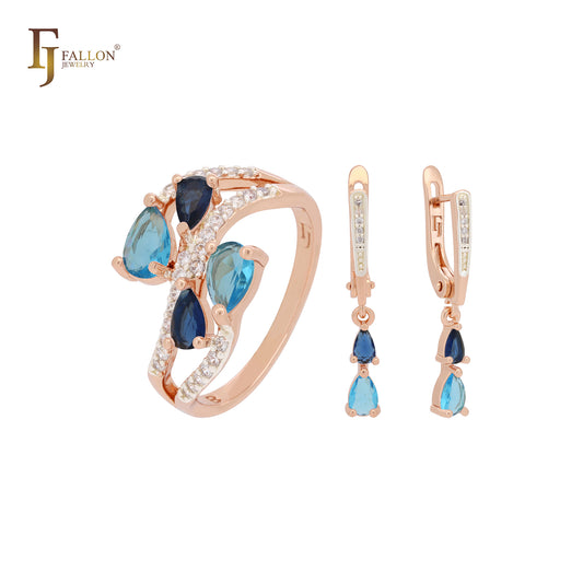 Conjunto de joyas de oro rosa con anillos y circonitas azules y blancas en racimo