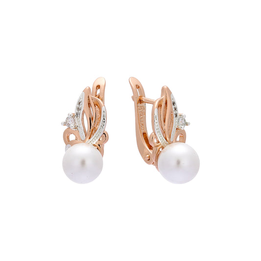 .Aretes de perlas en oro de 14 quilates, oro rosa, colores de baño en dos tonos.