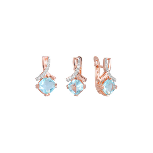 Rose Gold two tone solitaire lake blue stone set