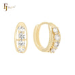 Pendientes Huggie de oro de 14 quilates con cuatro circonitas blancas redondeadas