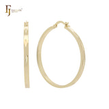 Aros anchos de 45 mm con forma de tubo brillante de oro de 14 quilates