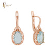 Pendientes de clip de oro rosa con circonitas cúbicas en azul lago con halo de filigrana y ondas abundantes
