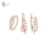 Conjunto de joyas de dos tonos en oro rosa con anillos y cintas entrelazadas de circonitas blancas