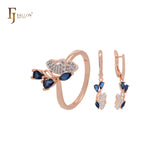 Conjunto de joyas en dos tonos de oro rosa con anillos y mariposa de circonitas blancas en racimo con circonitas azul profundo