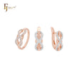 Conjunto de joyas de oro rosa de dos tonos con cruces infinitas entrelazadas con circonitas blancas y anillos.