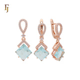 Conjunto de joyas de oro rosa con colgante en forma de rombo colgante de circonita azul lago con banda de circonitas blancas