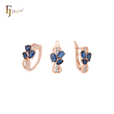 Conjunto de joyas de oro rosa en dos tonos con triple racimo de circonitas cúbicas ovaladas de color azul profundo y anillos
