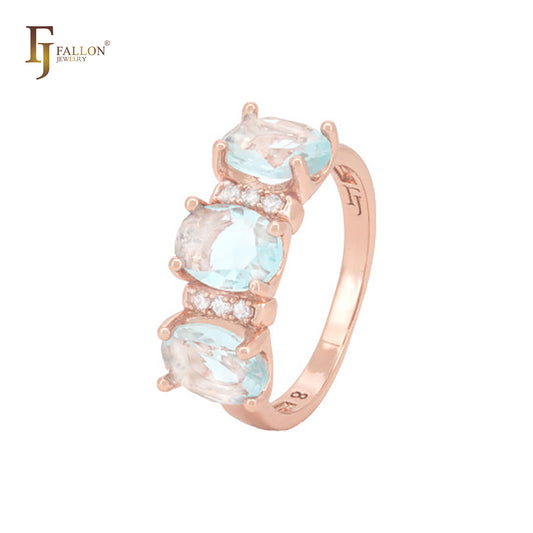 Anillos de moda en oro rosa con circonitas cúbicas triples ovaladas en azul lago y circonitas blancas.