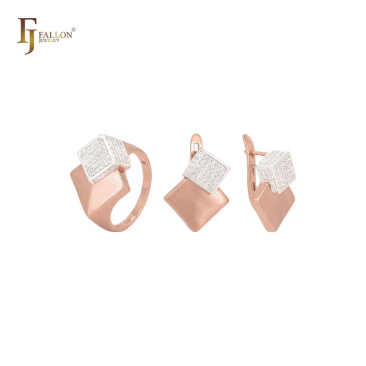 Conjunto de joyas de oro rosa con anillos y brillantes circonitas blancas incrustadas en un cubo.