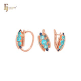 Conjunto de joyería de oro rosa con anillos y concha abierta que incluye cinco circonitas azules mixtas