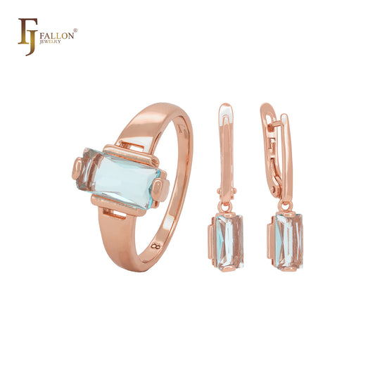 Conjunto de joyas de oro rosa con anillos y circonita cúbica azul lago de corte triangular.