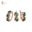 Conjunto de joyas de oro rosa con anillos, esmeralda en forma de pera y circonitas blancas