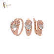 Lujoso conjunto de joyas de oro rosa con circonitas blancas, esmeralda o café y anillos.
