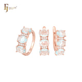 Conjunto de joyas de oro rosa con anillos y circonitas azul lago de triple óvalo con circonitas blancas