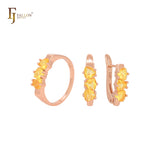 Conjunto de joyas con anillos en oro rosa y circonitas triangulares, triple champán, naranja y amarillo
