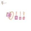Conjunto de joyas en oro rosa de dos tonos con corte esmeralda y circonitas blancas, anillos y colgante.