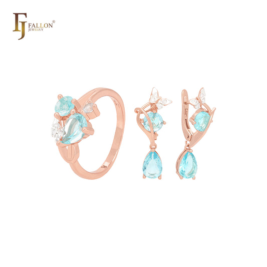 Conjunto de joyas de oro rosa con mariposa y circonitas azul lago y anillos