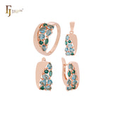 Conjunto de joyas de oro rosa con circonitas azules en racimo, anillos y colgante