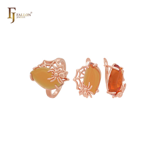 Gran conjunto de joyas de oro rosa con anillos, araña ámbar naranja y red de araña.