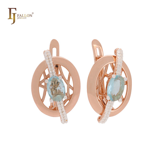 Pendientes de clip en oro rosa de dos tonos con solitario de circonita azul lago y cinta cruzada circular.