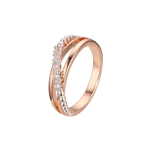 Alianzas de boda con cuentas en oro rosa y anillos bicolor de oro de 14 quilates.