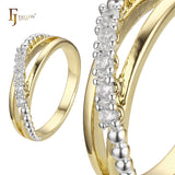Alianzas de boda con cuentas en oro rosa y anillos bicolor de oro de 14 quilates.