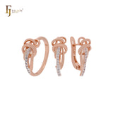 Maravilloso diseño de vides entrelazadas con circonitas blancas. Conjunto de joyas de oro rosa de dos tonos con anillos.