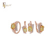Conjunto de joyas en oro rosa de dos tonos con anillos y colgante, solitario ovalado, circonita naranja grande y circonitas blancas.