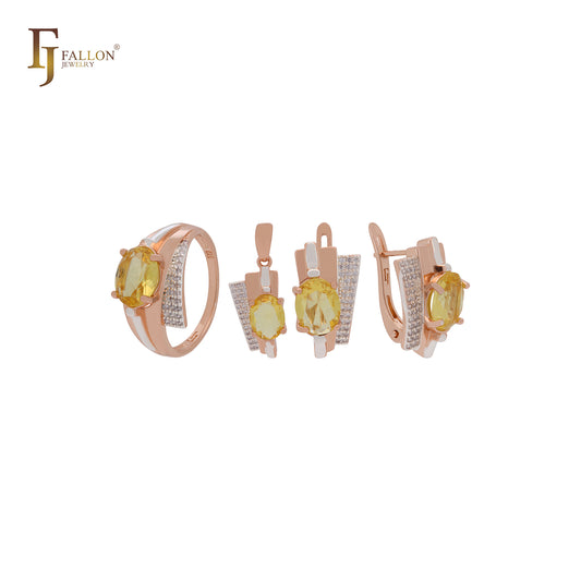 Conjunto de joyas en oro rosa de dos tonos con anillos y colgante, solitario ovalado, circonita naranja grande y circonitas blancas.