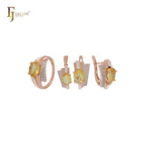 Conjunto de joyas en oro rosa de dos tonos con anillos y colgante, solitario ovalado, circonita naranja grande y circonitas blancas.