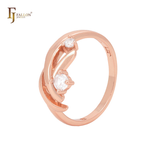 Anillos de moda en oro rosa con cintas cruzadas entrelazadas y doble circonita blanca.