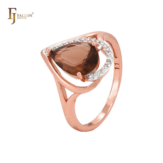 Anillo de moda en dos tonos de oro rosa con piedra café en forma de lágrima y circonitas blancas.