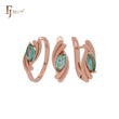 Conjunto de joyas de oro rosa con esmeralda marquesa de doble torsión y anillos