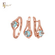 Conjunto de joyas de oro rosa con solitario redondo de circonita cúbica azul lago y anillos