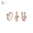 Conjunto de joyas de oro rosa de dos tonos con anillos y circonitas blancas en racimo de enlaces retorcidos