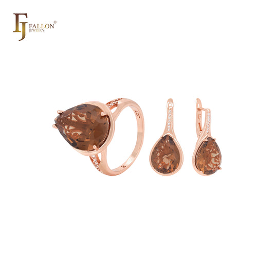 Conjunto de joyas de oro rosa con circonitas cúbicas y anillos en forma de pera grande.