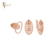 Conjunto de joyas de oro rosa con anillos y circonitas blancas en forma ovalada con textura de filigrana