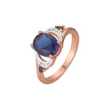 Solitario bicolor en Oro rosa con grandes anillos de piedra azul